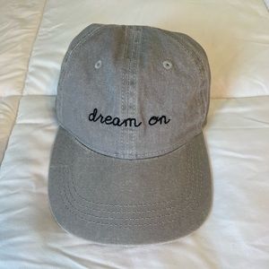 Grey baseball hat with “Dream On” embroidery
